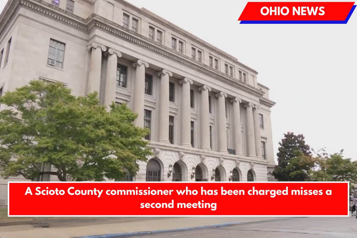 A Scioto County commissioner who has been charged misses a second meeting